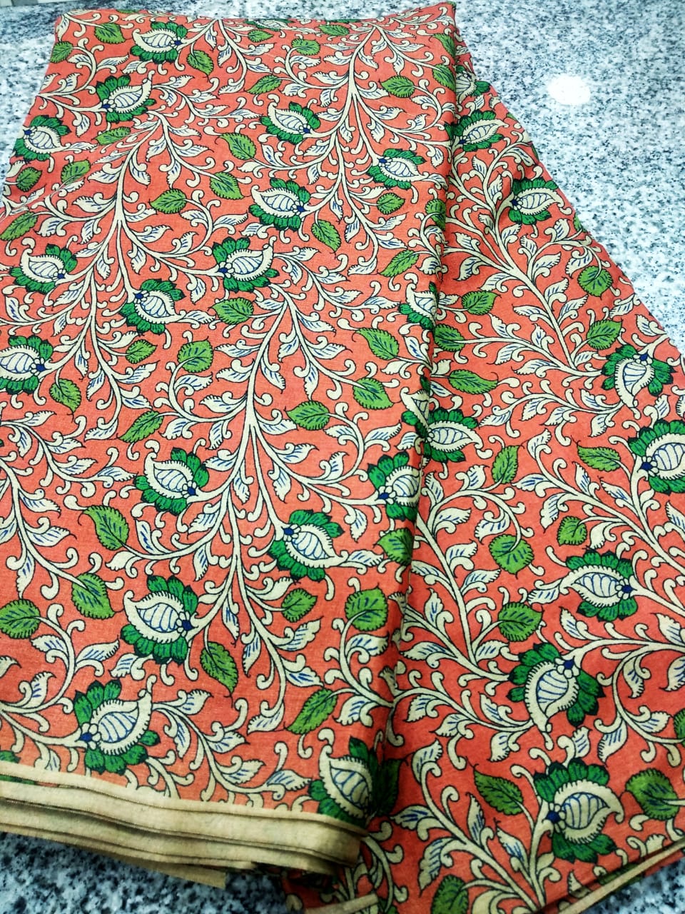 ORANGE COLOR KALAMKARI PRINTED TUSSAR FABRIC .
